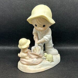 Precious Moments "Nothing Can Dampen The Spirit Of Caring " figurine